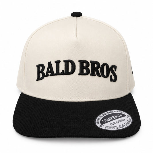 Bald Bros cream and black snapback hat front view
