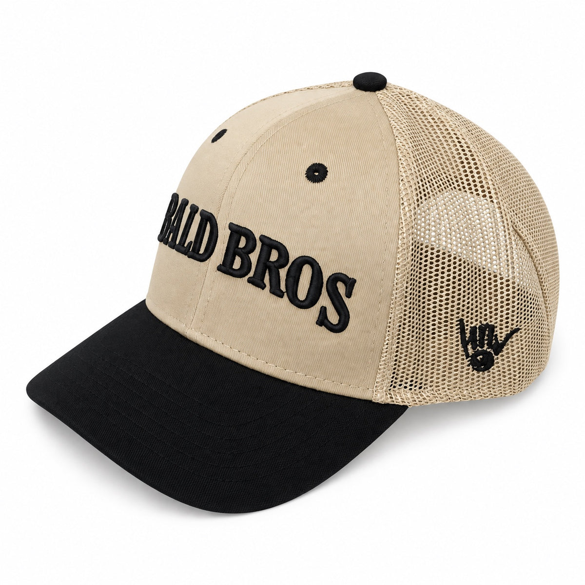 Bald Bros tan and black mesh trucker hat angled view